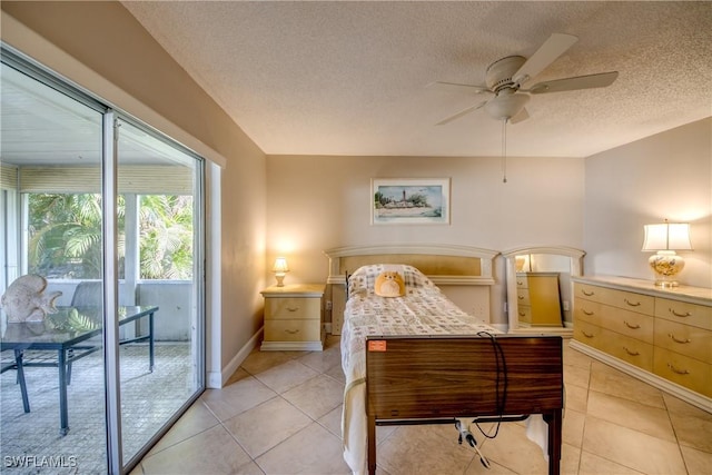 bedroom featuring light tile patterned floors, access to outside, a textured ceiling, and ceiling fan