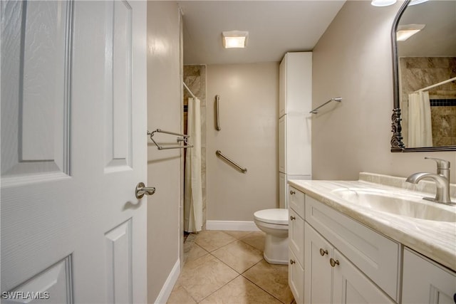 bathroom featuring tile patterned flooring, vanity, a shower with shower curtain, and toilet