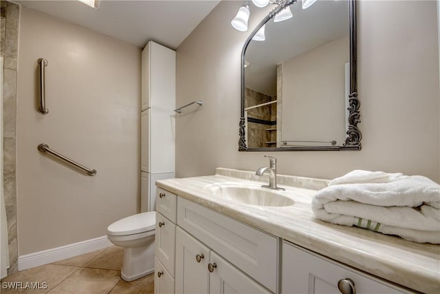 bathroom with tile patterned flooring, vanity, a shower, and toilet