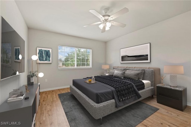 bedroom featuring light wood-type flooring and ceiling fan