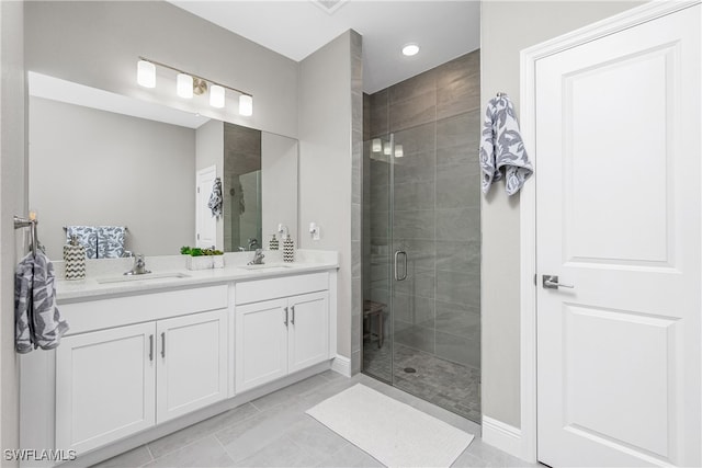 bathroom featuring vanity and a shower with shower door