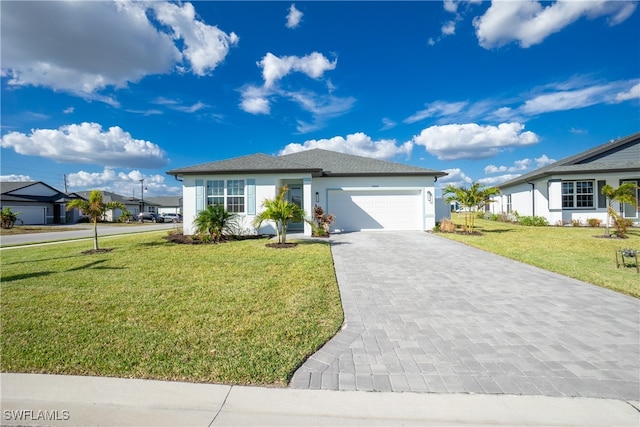 view of front of house with a front yard and a garage