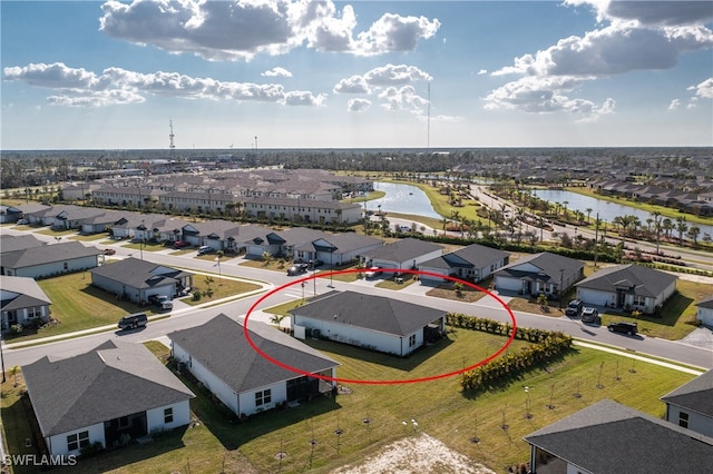 birds eye view of property featuring a water view