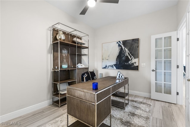 home office featuring light hardwood / wood-style floors and ceiling fan