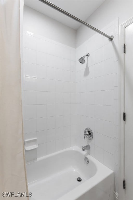 bathroom with shower / bath combination with curtain