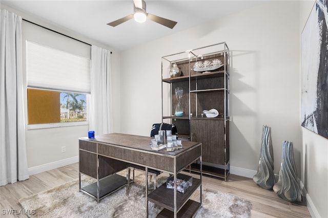 office area with hardwood / wood-style floors and ceiling fan