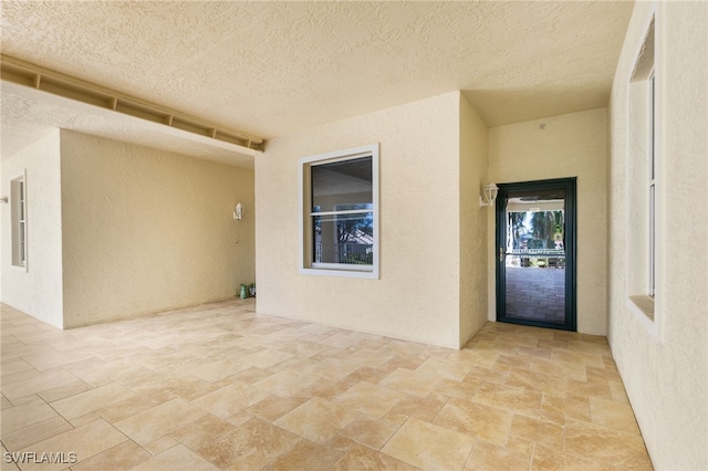 doorway to property featuring a patio area