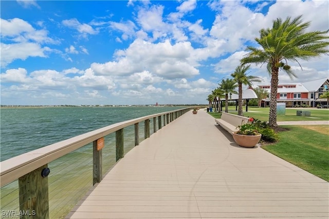 dock area featuring a yard and a water view