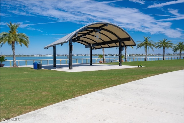 surrounding community featuring a yard and a water view