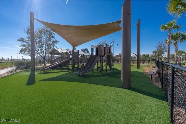 view of play area featuring a lawn