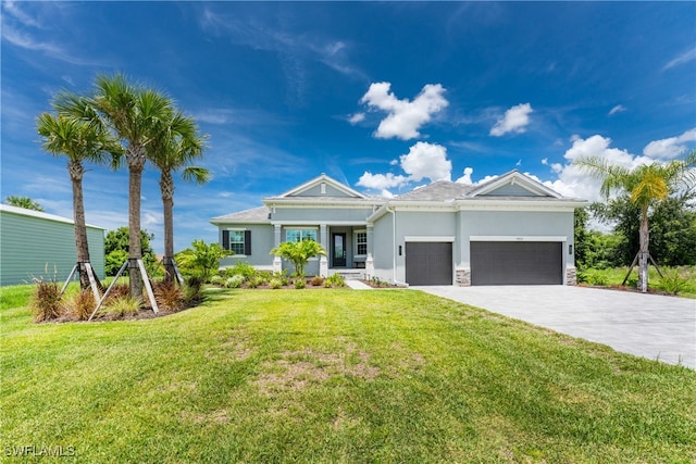 view of front of home featuring a garage and a front yard