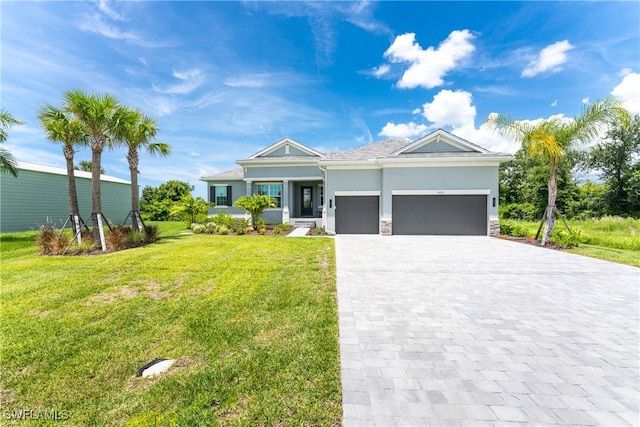 view of front of property featuring a garage and a front yard