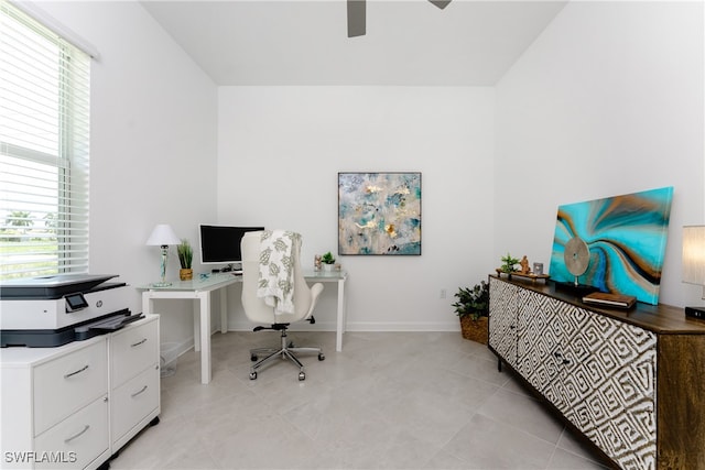 office with a wealth of natural light and ceiling fan