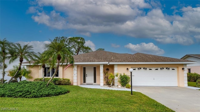 single story home featuring a front lawn and a garage