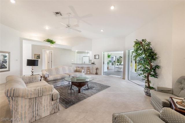 living room with lofted ceiling, carpet flooring, and ceiling fan