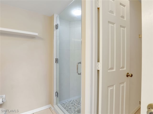 bathroom featuring an enclosed shower