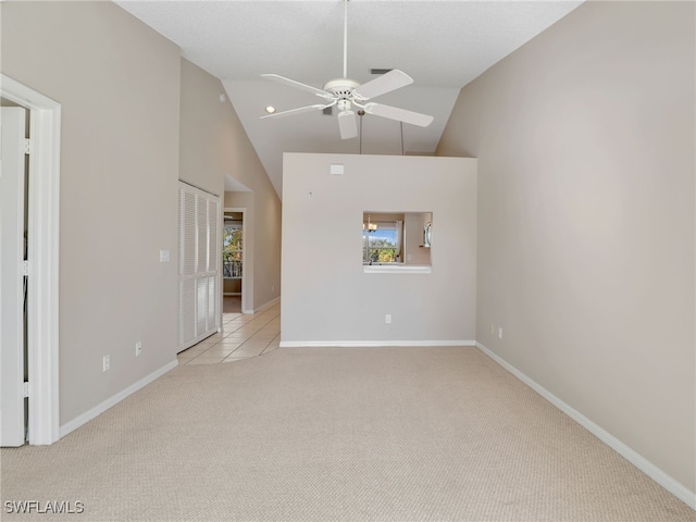 interior space with ceiling fan and lofted ceiling