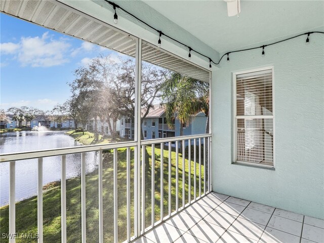 balcony featuring a water view