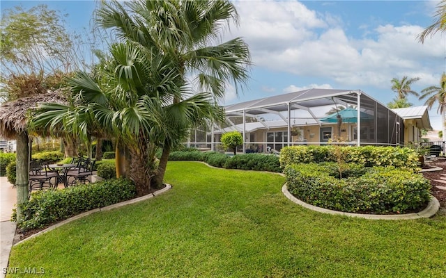 view of yard featuring a lanai