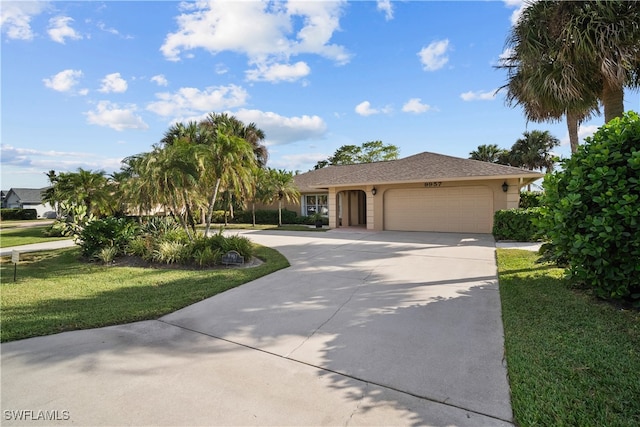 single story home with a front lawn and a garage