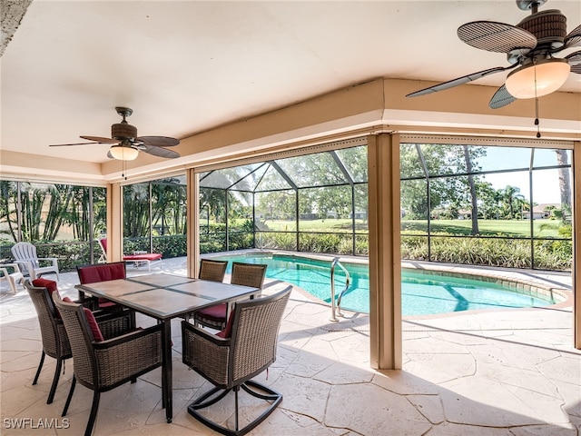 view of pool featuring ceiling fan, a lanai, and a patio area