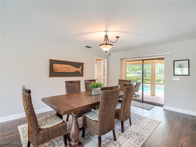 dining room featuring dark hardwood / wood-style flooring