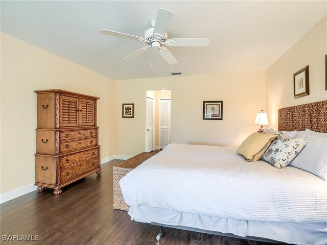 bedroom featuring ceiling fan and dark hardwood / wood-style flooring