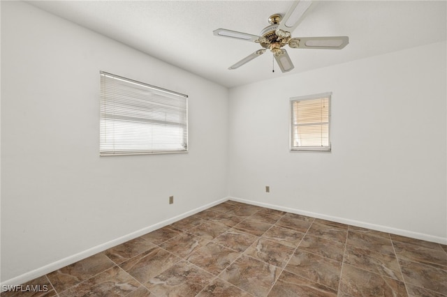 unfurnished room with ceiling fan