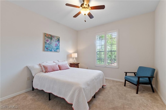 bedroom featuring carpet floors, baseboards, and a ceiling fan