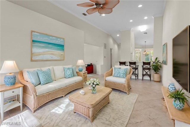 living area featuring ornamental molding, ceiling fan, recessed lighting, light tile patterned floors, and high vaulted ceiling