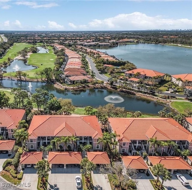 aerial perspective of suburban area with a large body of water and a golf course