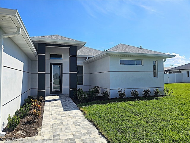 view of front of home with a front yard