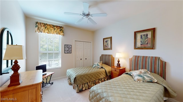 carpeted bedroom featuring multiple windows, a closet, and ceiling fan