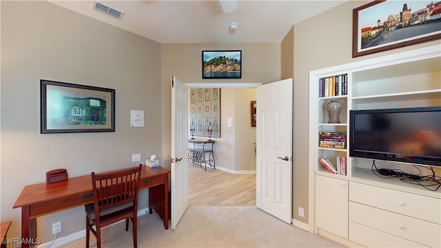 carpeted office featuring vaulted ceiling