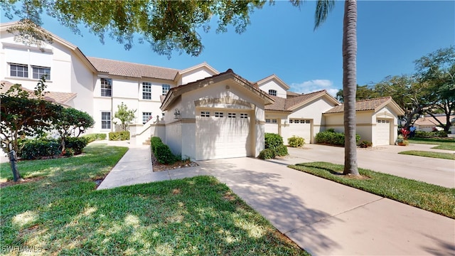 view of front of house with a front lawn and a garage