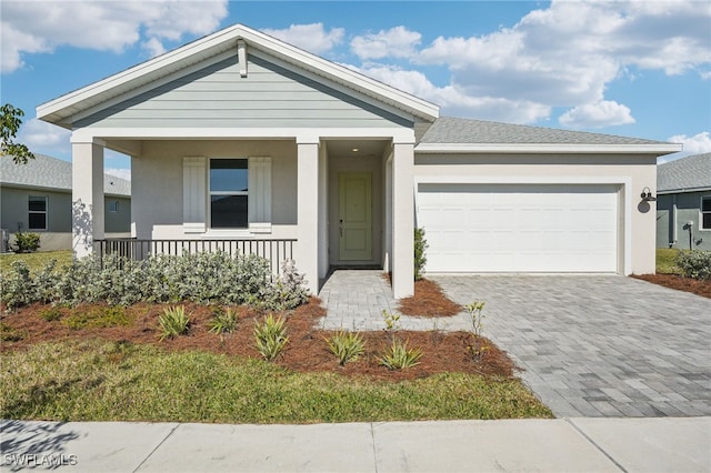 44290 Frontier Dr, Punta Gorda, FL 33982 - view of front of property featuring a garage and a porch