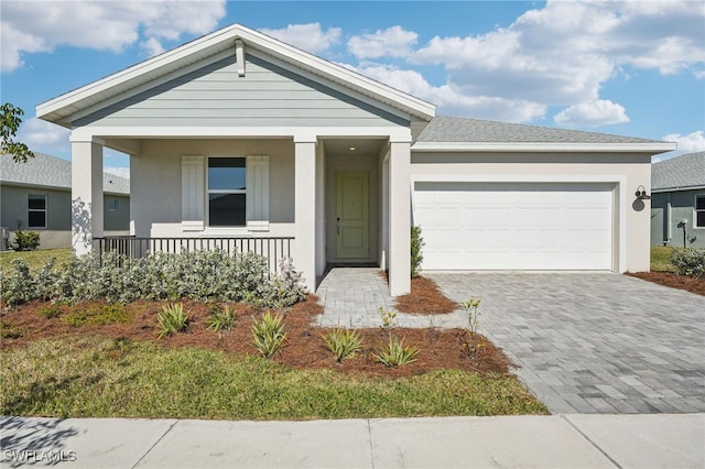 view of front of property featuring a garage and a porch