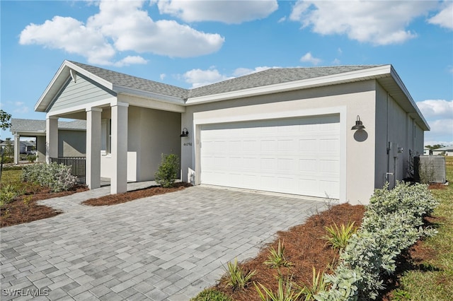 ranch-style home featuring a garage