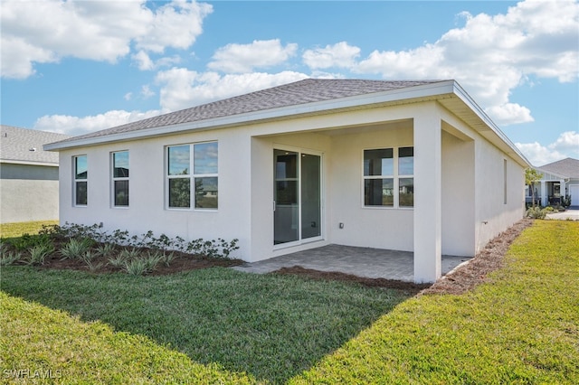 44290 Frontier Dr, Punta Gorda, FL 33982 - back of house featuring a patio and a yard
