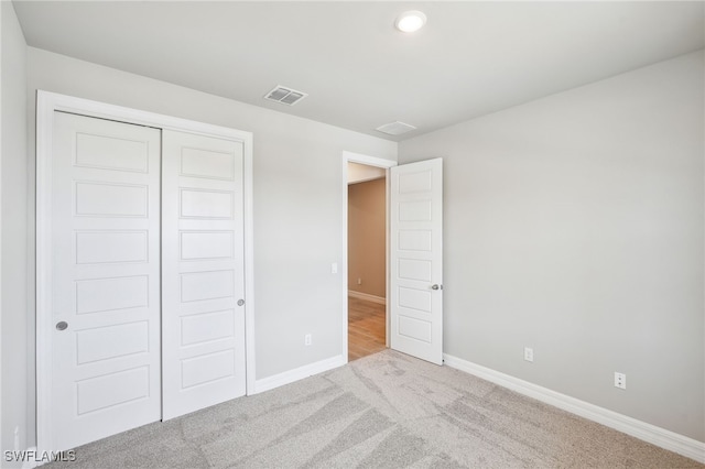 44290 Frontier Dr, Punta Gorda, FL 33982 - unfurnished bedroom with light colored carpet and a closet