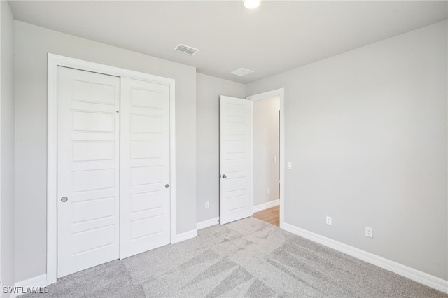 44290 Frontier Dr, Punta Gorda, FL 33982 - unfurnished bedroom with light carpet and a closet
