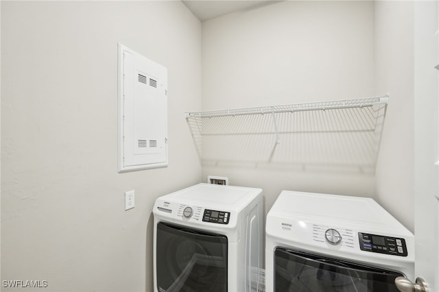44290 Frontier Dr, Punta Gorda, FL 33982 - clothes washing area with washing machine and dryer and electric panel