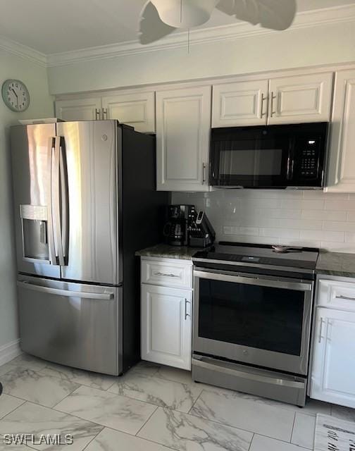 kitchen featuring marble finish floor, appliances with stainless steel finishes, white cabinets, and crown molding