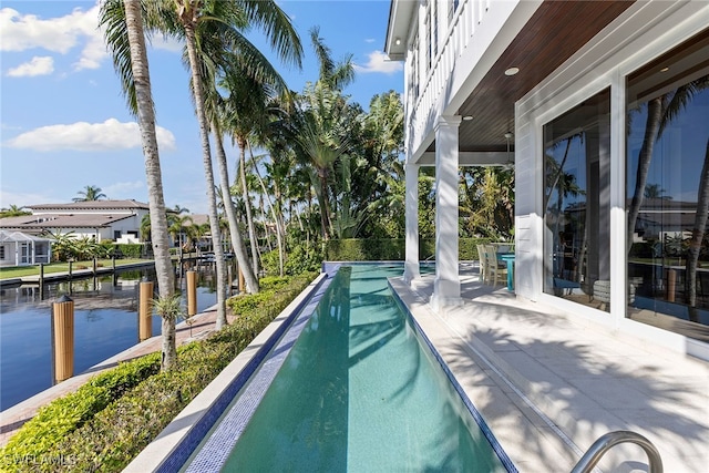 view of pool featuring a water view