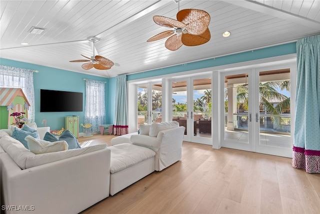 living room featuring french doors, light wood-type flooring, plenty of natural light, and ceiling fan