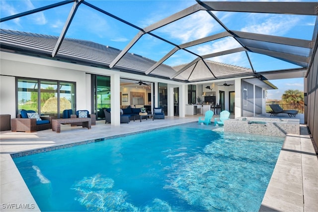 view of pool with glass enclosure, ceiling fan, an outdoor living space, a jacuzzi, and a patio area