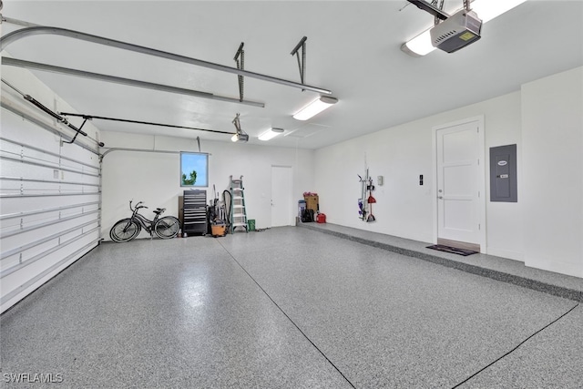 garage with electric panel and a garage door opener