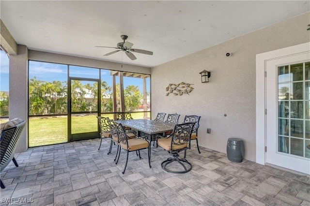 sunroom / solarium with ceiling fan