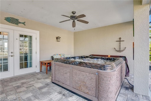 view of patio featuring ceiling fan and french doors