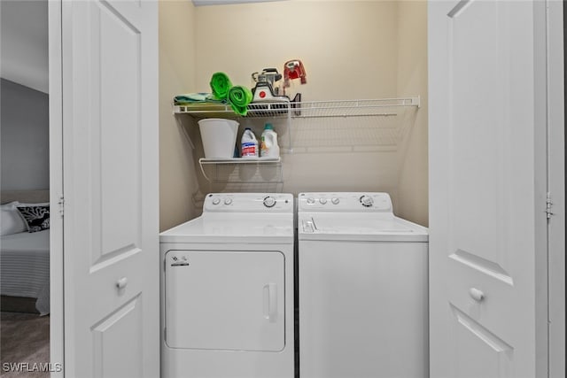 washroom featuring washer and clothes dryer